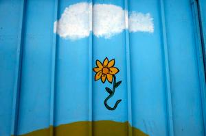 This 22 Oct. 2016 photo, a painted flower is seen on the wall of the Galvarino child care center where a young  girl named Lissette died while in the custody of the state, in Santiago, Chile. Lissette's case exploded in a crisis over the care of at-risk children that has outraged Chileans. After initially reporting just 185 deaths, the government recently acknowledged that 865 children have died under the care of the National Service for Minors over 11 years. (AP Photo/Luis Hidalgo)