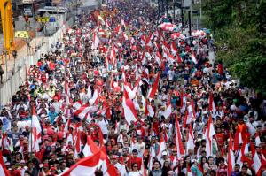 Indonesians march during a rally at Jakarta's main business district, Indonesia, Sunday, Nov. 20, 2016. More than 10,000 Indonesians took to the streets of their capital to call for tolerance and unity in the world's most populous Muslim nation, after police opened a blasphemy investigation into the city's Christian governor. (AP Photo/Tatan Syuflana)
