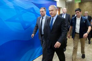 Israeli Prime Minister Benjamin Netanyahu, center, arrives for the weekly cabinet meeting, at his office, in Jerusalem, Sunday, Nov. 6, 2016. (Abir Sultan, via AP)
