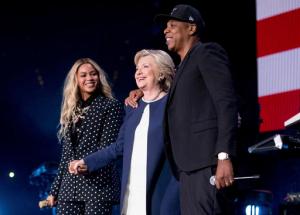 FILE - In this Nov. 4, 2016 file photo, Democratic presidential candidate Hillary Clinton, center, appears on stage with artists Jay Z, right, and Beyonce during a free concert at at the Wolstein Center in Cleveland. Few presidential candidates attracted so much celebrity support as did the former first lady and Secretary of State, but to so little reward. Rallies in Ohio with Beyonce and Jay Z did not prevent Republican rival and President-elect Donald Trump from prevailing. (AP Photo/Andrew Harnik, File)