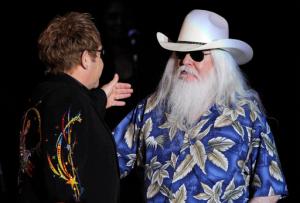 FILE - In this Nov. 3, 2010, file photo, Elton John, left, greets Leon Russell on the stage during their joint concert at the Hollywood Palladium in Los Angeles. Russell, who sang, wrote and produced some of rock 'n' roll's top records, has died. (AP Photo/Chris Pizzello, File)