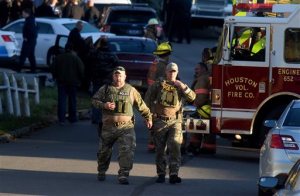 Law enforcement personnel gather after a nearby shooting in Canonsburg, Pa., Thursday, Nov. 10, 2016. Multiple western Pennsylvania police officers were "ambushed" and shot while responding to a domestic situation, authorities said. (Darrell Sapp/Pittsburgh Post-Gazette via AP)