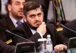 Mohammed Alloush, head of a Syrian opposition delegation, attends talks on Syrian peace in Astana, Kazakhstan, Monday, Jan. 23, 2017. The talks are the latest attempt to forge a political settlement to end a war that has by most estimates killed more than 400,000 people since March 2011 and displaced more than half the country's population. (AP Photo/Sergei Grits)