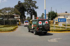 Bodies of Kenyan soldiers are transported by ambulances as they arrive at Wilson airport, Nairobi Kenya, Friday Jan 27, 2017. A spokesman for extremist group al-Shabab says its fighters have killed at least 51 Kenyan soldiers in an attack on an army base in Kulbiyow, a town in Lower Jubba region. (AP Photo/Khalil Senosi)