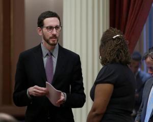 State Sen. Scott Wiener, D-San Francisco, left, talks with Sen. Holly Mitchell, D-Los Angeles, at the Capitol, Thursday, Jan. 26, 2017, in Sacramento, Calif. Wiener, and Sen. Toni Atkins, D-San Diego, introduced legislation on Thursday to add a non-binary gender option on state identifying documents including driver's licenses, birth certificates and identity cards.AP Photo/Rich Pedroncelli)