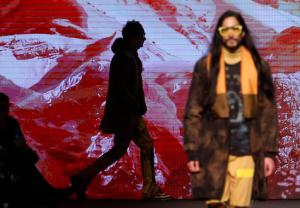 Models wear creations for Etro men's Fall-Winter 2017-2018 collection, part of the Milan Fashion Week, unveiled in Milan, Italy, Monday, Jan. 16, 2017. (AP Photo/Antonio Calanni)