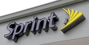 This Friday, Oct. 28, 2016, photo shows a Sprint sign in Miami. Sprint is buying a 33 percent stake in Tidal, the music streaming service owned by artists including Jay-Z, Madonna and Kanye West, the companies announced Monday, Jan. 23, 2017. (AP Photo/Alan Diaz)