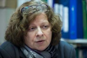 In this photo taken on Wednesday, Jan. 18, 2017, Activist Irina Matvienko speaks to the Associated Press at her home in Moscow, Russia. Matvienko, whose online petition against the bill to decriminalize domestic violence has attracted more than 180,000 signatures, sees the efforts to decriminalize this as a continuation of the Kremlin's increasingly aggressive policy abroad as well as at home after several repressive laws targeting various groups, from foreign-funded NGOs to gay people. (AP Photo/Pavel Golovkin)