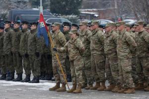 Polish, left, and U.S. soldiers attend the official welcoming ceremony of the U.S. troops in Zagan, Poland, Saturday, Jan. 14, 2017. The ceremony comes 23 years after the last Soviet troops left Poland and also marks a new historic moment — the first time any Western forces are being deployed on a continuous basis to NATO's eastern flank. (AP Photo/Krzysztof Zatycki)