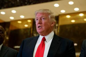 FILE - In this Jan. 13, 2017 file photo, President-elect Donald Trump speaks with reporters in the lobby of Trump Tower in New York. Trump’s decision not to appoint any Latinos to his cabinet is drawing fierce criticism from Hispanics who called it a major setback given that Latinos are now the nation’s largest minority group.  (AP Photo/Evan Vucci, File)