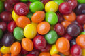 FILE- This June 1, 2016, file photo shows Skittles in New York. Mars Inc., the maker of Skittles and M&M’s, is breaking ranks with other food companies. It’s denouncing an industry-funded paper that says recommendations on limiting sugar are based on weak science. (AP Photo/Mark Lennihan, File)