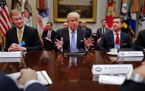 President Donald Trump speaks while hosting a breakfast with business leaders in the Roosevelt Room of the White House in Washington, Monday, Jan. 23, 2017. At left is Wendell P. Weeks, Chief Executive Officer of Corning, at right is Alex Gorsky Chairman and Chief Executive Officer of Johnson & Johnson. (AP Photo/Pablo Martinez Monsivais)