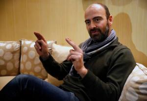 Kinan Azmeh, 40, a Syrian musician who is one of thousands of valid US green card holders who have found their immigration status in limbo after Trump's order Friday, gives an interview to The Associated Press, in Beirut, Lebanon, Sunday, Jan. 29, 2017. Azmeh, who plays the clarinet, and is currently touring with renowned cellist Yo-Yo Ma, said he is waiting to see whether he will be allowed to return to his New York home in the wake of President Donald Trump's travel ban on seven Muslim-majority nations. Azmeh, said he does not have a "plan B" if he is not allowed back into the United States on his scheduled return Wednesday. (AP Photo/Hussein Malla)