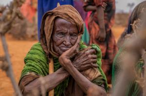 An elderly women waits for food aid in the Warder district in the Somali region of Ethiopia, Saturday Jan. 28, 2017. Ethiopia is struggling to counter a new drought in its east that authorities say has left 5.6 million people in urgent need of assistance. (AP Photo/Mulugeta Ayene)