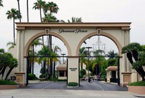 FILE - In this July 8, 2015 file photo, the main gate to Paramount Studios is seen on Melrose Avenue, in Los Angeles. Paramount Pictures said it has inked a co-financing deal with two Chinese companies for the Hollywood studio's slate of movies over the next three years, in a statement released Friday, Jan. 20, 2017. (AP Photo/Nick Ut)