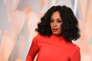 FILE - In this Feb. 22, 2015 file photo, Solange Knowles arrives at the Oscars at the Dolby Theatre in Los Angeles.  While the official pre-inaugural concert attended by Donald Trump was heavy on country music, it was Solange Knowles and Esperanza Spalding that entertained an enthusiastic gathering, Thursday, Jan. 19, 2017,  at the Peace Ball, an alternative inaugural event organized by progressive activists.(Photo by Jordan Strauss/Invision/AP)