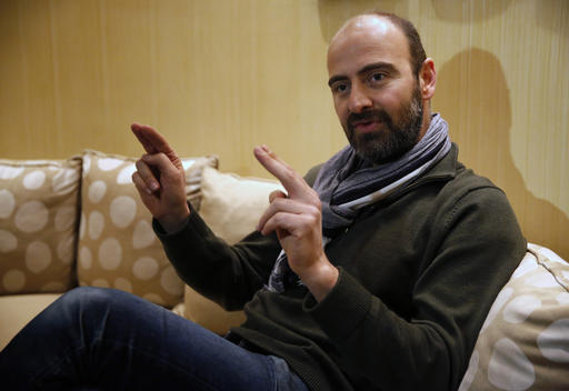Kinan Azmeh, 40, a Syrian musician who is one of thousands of valid US green card holders who have found their immigration status in limbo after Trump's order Friday, gives an interview to The Associated Press, in Beirut, Lebanon, Sunday, Jan. 29, 2017. Azmeh, who plays the clarinet, and is currently touring with renowned cellist Yo-Yo Ma, said he is waiting to see whether he will be allowed to return to his New York home in the wake of President Donald Trump's travel ban on seven Muslim-majority nations. Azmeh, said he does not have a "plan B" if he is not allowed back into the United States on his scheduled return Wednesday. (AP Photo/Hussein Malla)