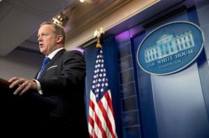 In this Feb. 21, 2017, file photo, White House press secretary Sean Spicer speaks during the daily press briefing at the White House in Washington. The Trump administration could revise or withdraw an Obama-era directive requiring public schools to let transgender students use bathrooms and locker rooms that match their chosen gender identity. Spicer said Tuesday the Justice Department is working on a new set of guidelines on bathroom access but offered no other details. (AP Photo/Andrew Harnik)