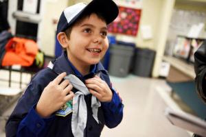 In this Feb. 7, 2017 photo, Joe Maldonado, the first openly transgender member of the Boy Scouts, shows off the uniform he received from Scout leader Kyle Hackler to wear to his first meeting in Maplewood, N.J. Boy Scouts of America recently changed its policy to allow transgender children to join the organization. "I am accepted," Maldonado said as he put on the uniform. (Amy Newman/The Record via AP)