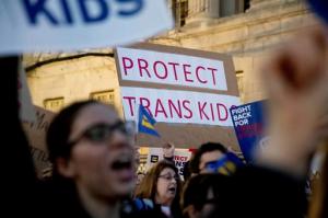 Activists and protesters with the National Center for Transgender Equality rally in front of the White House, Wednesday, Feb. 22, 2017, in Washington, after the Department of Education and the Justice Department announce plans to overturn the school guidance on protecting transgender students. (AP Photo/Andrew Harnik)