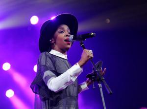 FILE - This Feb. 5, 2014 file photo shows singer Lauryn Hill performing at Amnesty International's "Bringing Human Rights Home" Concert in New York. Hill took the stage in Pittsburgh, on Tuesday, Jan. 31, 2017, more than three hours late. (Photo by Evan Agostini/Invision/AP, File)