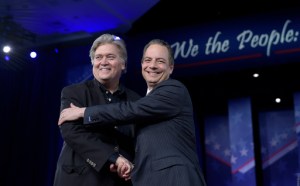 White House Chief of Staff Reince Priebus, right, hugs White House strategist Stephen Bannon as they are introduced to speak at the Conservative Political Action Conference (CPAC) in Oxon Hill, Md., Thursday, Feb. 23, 2017. (AP Photo/Susan Walsh)