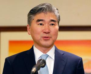FILE - In this Dec. 1, 2016 file photo, new U.S. Ambassador to the Philippines Sung Kim addresses the media shortly upon his arrival at the Ninoy Aquino International Airport in suburban Pasay city, south of Manila, Philippines, to succeed his predecessor Philip Goldberg. The United States is not building any weapons depot anywhere in the Philippines, Kim said Tuesday, Jan. 31, 2017, denying the basis on which President Rodrigo Duterte threatened to abrogate a 2014 defense pact that allows U.S. forces to temporarily base in local camps. The U.S. ambassador said that nothing is being planned now that even closely resembles a weapons depot. (AP Photo/Bullit Marquez, File)