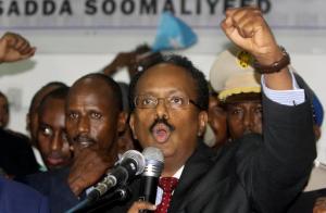 New Somali President Mohamed Abdullahi Farmajo celebrates winning the election and taking office in Mogadishu, Somalia Wednesday, Feb. 8, 2017. Former prime minister Farmajo who holds dual Somali-U.S. citizenship was declared Somalia's new president Wednesday, immediately taking the oath of office as the long-chaotic country moved toward its first fully functioning central government in a quarter-century. (AP Photo/Farah Abdi Warsameh)