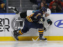 Buffalo Sabres Jake McCabe and San Jose Sharks Joe Pavelski (8) collide along the boards during the second period of an NHL hockey game, Tuesday, Feb. 7, 2017, in Buffalo, N.Y. (AP Photo/Jeffrey T. Barnes)