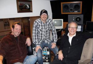 FILE - In this Dec. 18, 2013, file photo, pop singer Bobby Vee, right, poses with sons Jeff Velline, left, and Tommy Velline, at his family's Rockhouse Productions in St. Joseph, Minn. Two of Vee's four children have filed a court petition claiming their siblings are misusing money from the late singer's estate. Robby Velline and Jennifer Whittet Velline claim in the petition that their brothers, Tommy and Jeff, have used money from the estate for their personal benefit and to support Rockhouse Productions. Tommy and Jeff have filed a counter petition that says their actions had the approval of their parents. Bobby Vee died in October 2016 of advanced Alzheimer's disease. (AP Photo/Jeff Baenen, File)