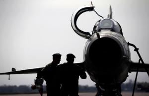 In this Wednesday, April 6, 2016 photo, ground crew prepares a Mig 21 fighter jet for a flight at the military airport Batajnica, near Belgrade, Serbia. Serbia's defense minister said Sunday, Feb. 12, 2017 the country is getting a shipment of Russian fighter jets, supplies that could worsen tensions with neighboring states. (AP Photo/Darko Vojinovic)