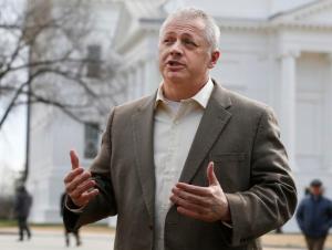 Republican candidate for Virginia governor, Denver Riggleman, speaks during a news conference at the Capitol in Richmond, Va., Tuesday, Jan. 31, 2017. Riggleman addressed the killing of bill that would bar political contributions from regulated monopolies. Donald Trump's path to the presidency included the unusual step of attacking individual major companies, like retailers Macy's and Amazon. Now insurgent candidates in Virginia's gubernatorial race — one of the most closely watched contests of 2017 — are employing the same technique. Their target: energy giant Dominion Resources, who critics says uses its political leverage to abuse property rights and overcharge its customers for electricity. Dominion, the biggest corporate donor in Virginia politics, says its customers are happy with its service.(AP Photo/Steve Helber)