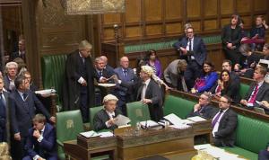 This image taken from Parliamentary Recording Unit TV shows the result of the parliamentary vote in favour of the British Government's Brexit Bill being handed to the Speaker of the House of Commons, Wednesday, Feb. 1, 2017. British lawmakers have backed a bill authorizing the start of European Union exit talks, voting by a decisive 498 to 114 to push the measure past its first major legislative hurdle. (AP Photo/Parliamentary Recording Unit, via AP)