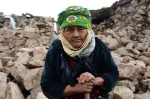 An villager stands in front of her damaged house after two earthquakes, both with preliminary magnitudes of 5.3, jolted Turkey's northern Aegean coast, in Yukarikoy village Canakkale province, Monday, Feb. 6, 2017, damaging dozens of homes in at least five villages and injuring several people.(Mustafa Suicmez/DHA-Depo Photos via AP)