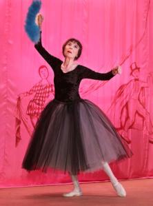 FILE - In this Oct 1, 2005 file photo, Marta Becket dances "en pointe" during the inaugural performance of "Masquerade" at the Amargosa Opera House in Death Valley Junction, Calif. Becket, a performance artist who spent decades presenting on one-woman shows at a remote Mojave Desert community hall that she transformed with paint brush and passion and made famous as the Amargosa Opera House, died Monday, Jan. 30, 2017, at her home. She was 92. (Sam Morris/The Las Vegas Sun via AP, File)