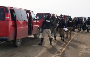 Authorities arrest the last remaining holdouts in the now-closed Dakota Access pipeline protest camp in southern North Dakota near Cannon Ball on Thursday, Feb. 23, 2017. Police made about several dozen arrests, and declared the camp cleared after about 3 1/2 hours. (Mike McCleary/Bismarck Tribune via AP)