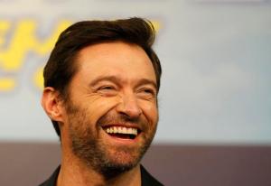FILE - In this March 7, 2016, file photo, actor Hugh Jackman smiles during a press conference in Seoul, South Korea. Jackman posted a selfie on social media Feb. 13, 2017, showing off his bandaged nose following treatment for skin cancer. (AP Photo/Lee Jin-man, File)