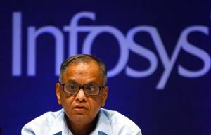 FILE- In this June 15, 2013 file photo, N. R. Narayana Murthy, Executive Chairman of Indian tech giant Infosys, reacts to a shareholders comment during the company's 32th Annual General Meeting in Bangalore, India. Speculation about tougher rules on so-called H-1B visas, used heavily by India’s massive technology and outsourcing industries to send programmers and other computer specialists to the United States, sent tech stocks tumbling in India early February, 2017, and compounded concerns about the protectionist direction of U.S. policy after President Donald Trump temporarily suspended immigration from seven Muslim-majority countries. Murthy cautioned that the Indian software industry’s role in building and maintaining the information infrastructure of major U.S. corporations is critical to their success. “Tampering with it is not going to be easy," he said. (AP Photo/Aijaz Rahi, File)