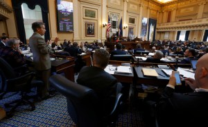 Del. S. Chris Jones, R-Suffolk, left, chairman of the House Appropriations committee, presents the budget conferees' report to members of the Virginia House of Delegates in Richmond, Va., Saturday, Feb. 25, 2017, the last day of the 2017 legislative session. The bill passed, 96-1. (Bob Brown /Richmond Times-Dispatch via AP)