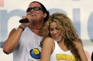 FILE - In this July 20, 2008 file photo, Colombian singers Shakira, right, and Carlos Vives perform during a "concert for peace" Independence Day celebrations in Leticia, Colombia. A Cuban singer and music producer has filed a plagiarism lawsuit filed Thursday March 3, 2017 against pop stars Shakira and Carlos Vives for allegedly copying excerpts of a decade-old song in the Colombian duo's award-winning music hit 'La Bicicleta.' (The Bike, in English). (AP Photo/William Fernando Martinez, File)
