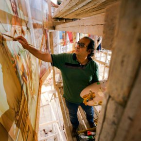 Egyptian artist paints church murals, unfazed by attacks