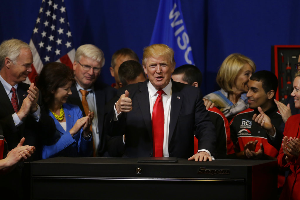 AP FACT CHECK: Trump ignores 100-day high&nbsp;achievers