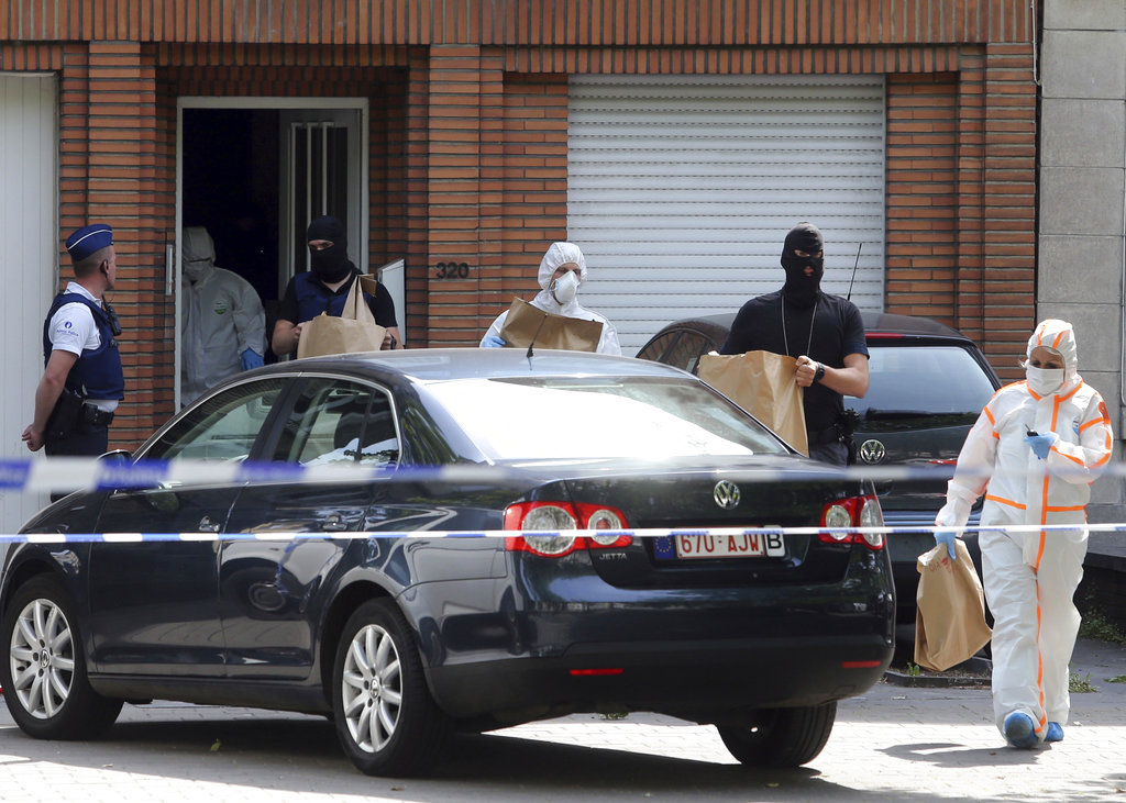 The Latest: Police raid home of Brussels attack&nbsp;suspect