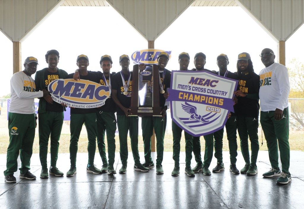 Norfolk State University Men's Cross Country Team holding MEAC Cross Country Championship trophy. Photo courtesy of NSUSpartans.com and used with permission.